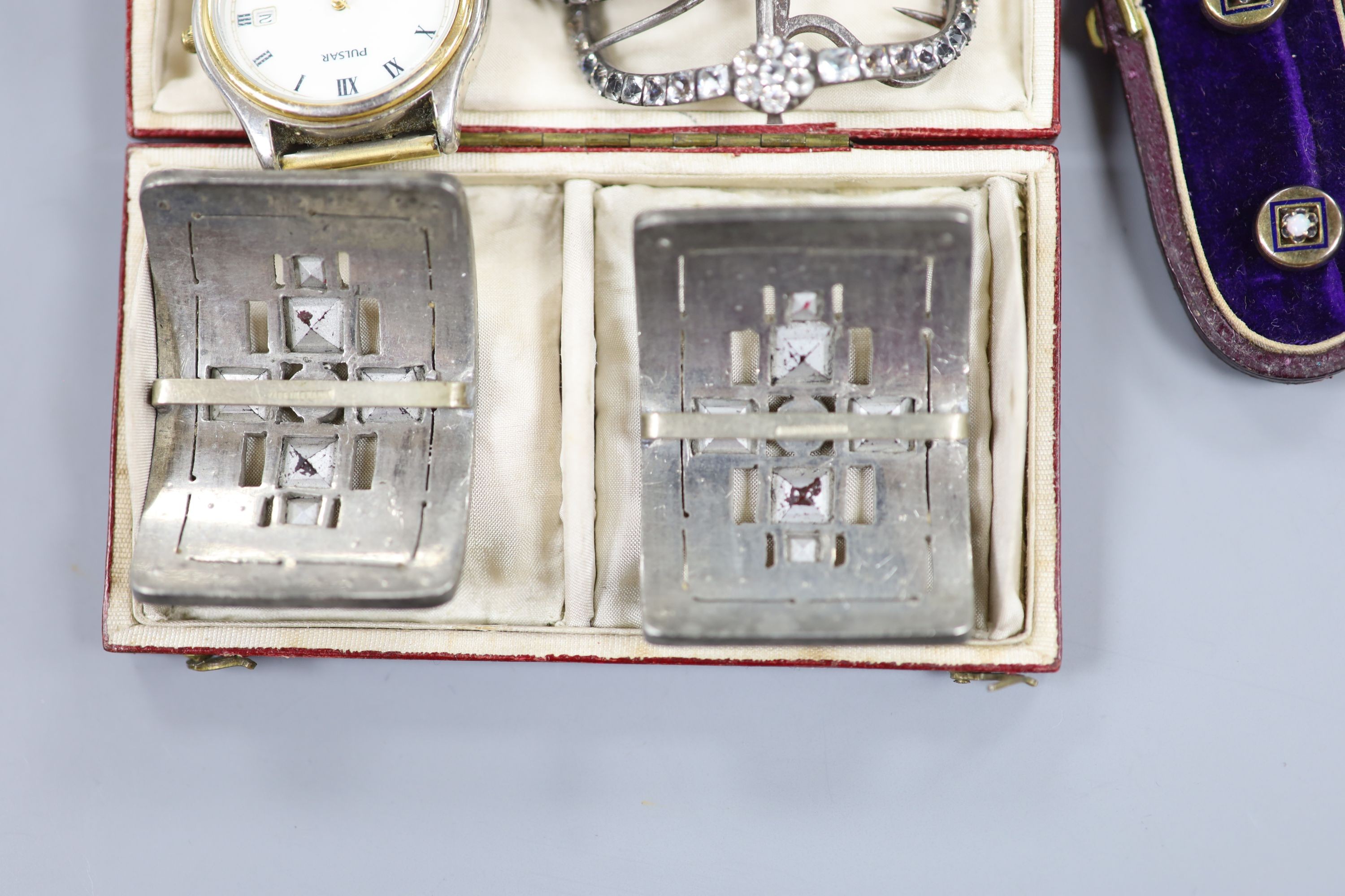 A pair of steel and paste set shoe buckles, one other pair, a cased set of three opal set dress studs and a Pulsar watch.